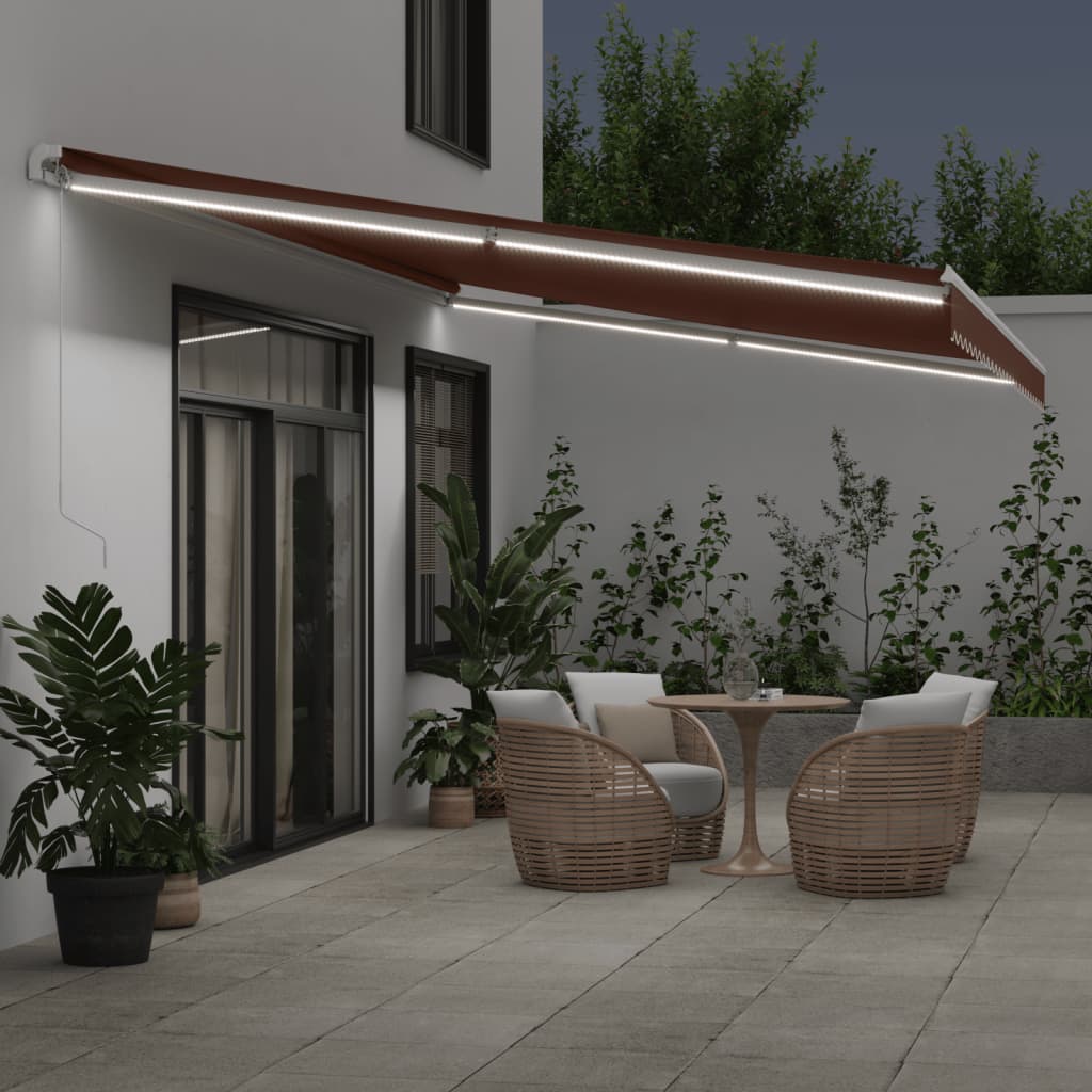 Manuell uttrekkbar markise med LED brun 600x350 cm